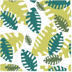 Green leaves in abstract style on green background. Seamless pattern. Decorative textile seamless pattern.