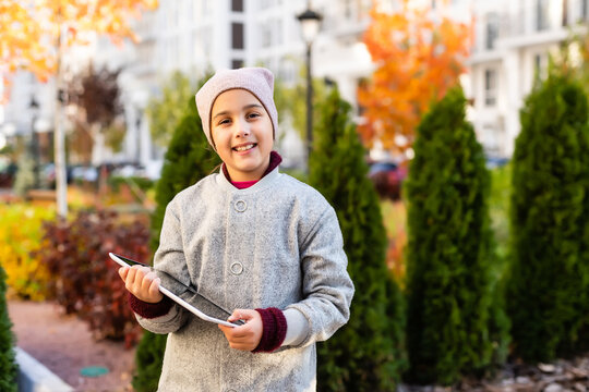 picture of beautiful pre-teen girl with tablet pc