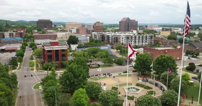 Huntsville, Alabama Skyline With Drone Video Moving Up Showing Flags.