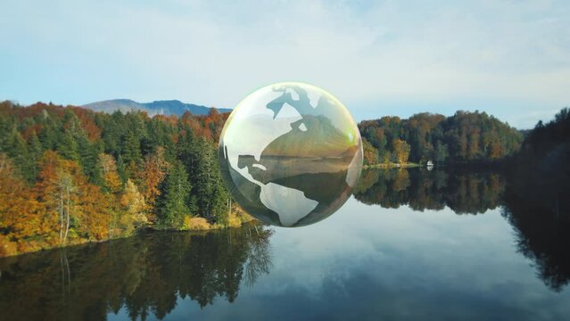 Mother earth concept, world globe rotating above a calm autumn lake - 3D render