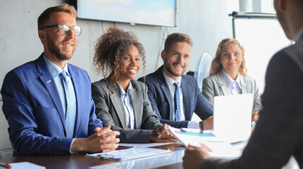 Job interview with the employer, businessman listen to candidate answers.