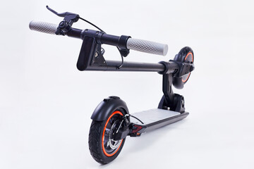 Folding Electric Scooter Isolated on White background. Eco alternative Personal Transport. Black...