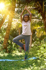 Asian girl doing yoga exercise