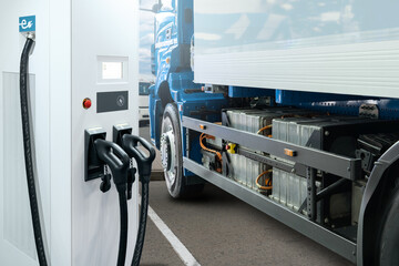 Electric vehicles charging station on a background of a truck. Concept