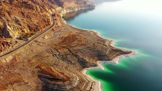 Aerial Panning Shot Of Natural Dead Sea By Rock Formations - Jordon Rift Valley, Jordan