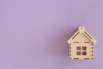 Mini residential craft house on a violet background