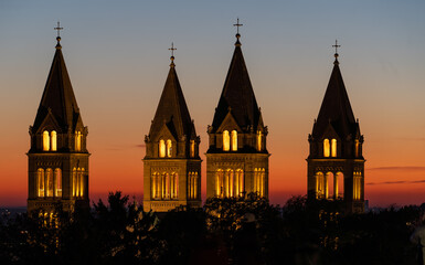 Fototapeta premium Detail of cathedral towers with sunrise