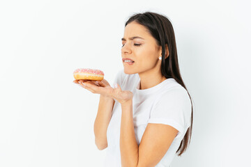 Portrait of young woman resist to eat junk food