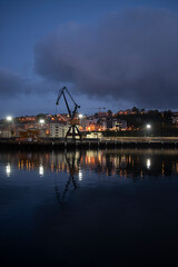 Fototapeta na wymiar reflections of the harbor lights at night