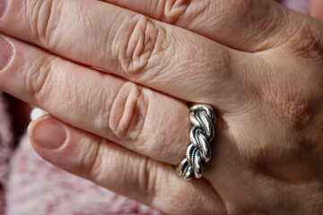 Hand with Latvian traditional 'King Namejs' silver ring