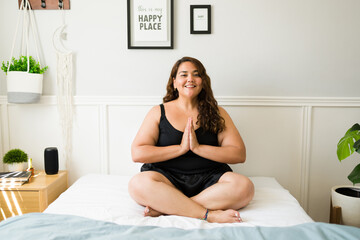 Hispanic fat woman meditating and relaxing - obrazy, fototapety, plakaty