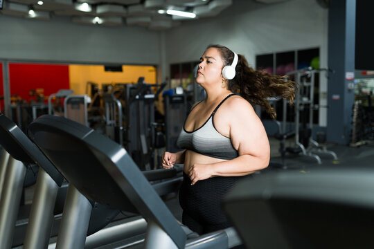 Determined woman working out to lose weight