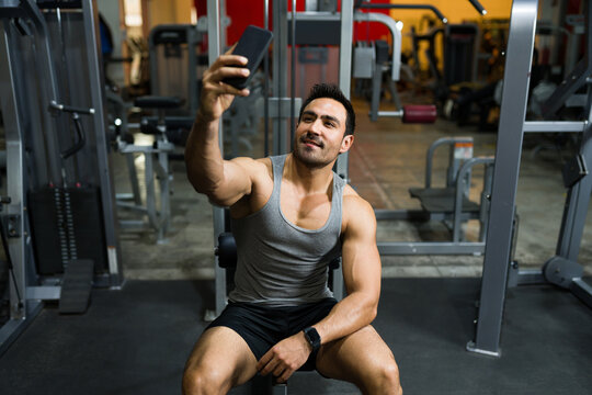 Young man taking a picture at the gym