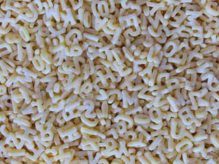 Pasta letter close-up (macroscopic photo) - Texture background - Food