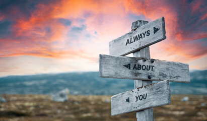 always about you text quote caption on wooden signpost outdoors in nature with dramatic sunset skies. Panorama crop. yourself concept. - obrazy, fototapety, plakaty