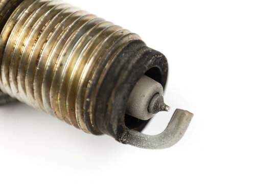 The electrode on the used iridium spark plug. Close up. Isolated on a white background