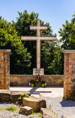Memorial cross for Covid-19 epidemic victims on top of Lysa Gora, Swiety Krzyz mount at Benedictive Abbey in Swietokrzyskie Mountains near Nowa Slupia village in Poland - obrazy, fototapety, plakaty