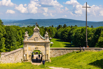 Swiety Krzyz, Poland - June 5, 2022: Lysa Gora, Swiety Krzyz mount hilltop with gate to medieval Benedictive Abbey and sanctuary in Swietokrzyskie Mountains near Nowa Slupia village in Poland