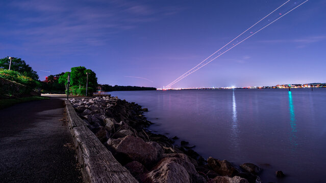 Planes take off and and at night over the Potomac River outside Washington DC