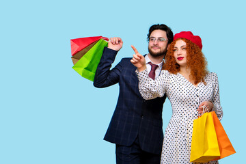 Couple with Colorful Paper Shopper Bags