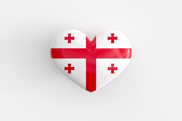 Georgian souvenir - a heart-shaped badge with the flag of Georgia as a symbol of patriotism and pride in their country. State symbol of Georgia on a glossy badge. 3D rendering