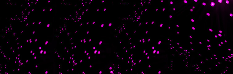 Fototapeta na wymiar Blurred glitter background with purple blinking confetti