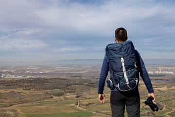 Unrecognizable photographer holding the camera in his hand with amazing views