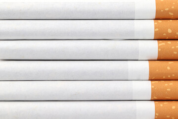 Lots of cigarettes on white background. Drugs are harmful to the lungs.