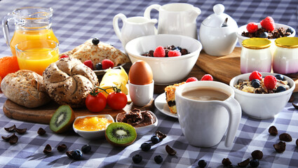 Breakfast served with coffee, juice, croissants and fruits