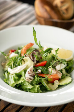 organic mixed green salad with fresh seafood in portugal