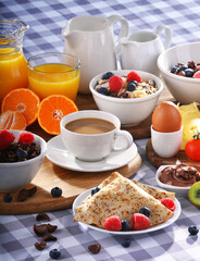 Breakfast served with coffee, juice, croissants and fruits