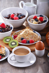 Breakfast served with coffee, juice, croissants and fruits