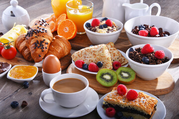 Breakfast served with coffee, juice, croissants and fruits