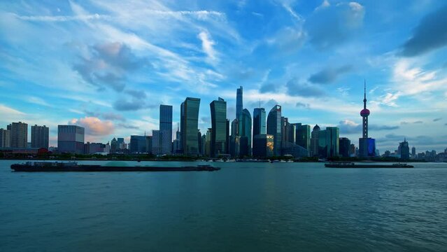 Modern commercial buildings and skyline in Shanghai at sunset, China. Day to night time lapse video.