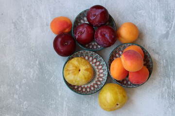 Still life photo with seasonal fruit. Colorful picture of summer fruit on a table. 