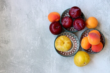 Still life photo with seasonal fruit. Colorful picture of summer fruit on a table. 
