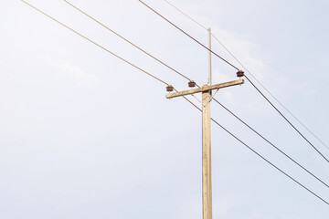 electric poles  against the background of a bright blue sky