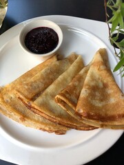 Pancakes with black currant jam