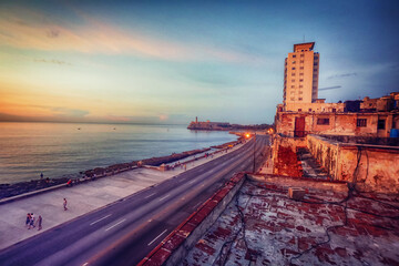 Sunset at Malecon, the famous Havana promenades where Habaneros, lovers and most of all individual fishermen meet, Havana, Cuba - obrazy, fototapety, plakaty