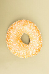sesame bagel isolated on green