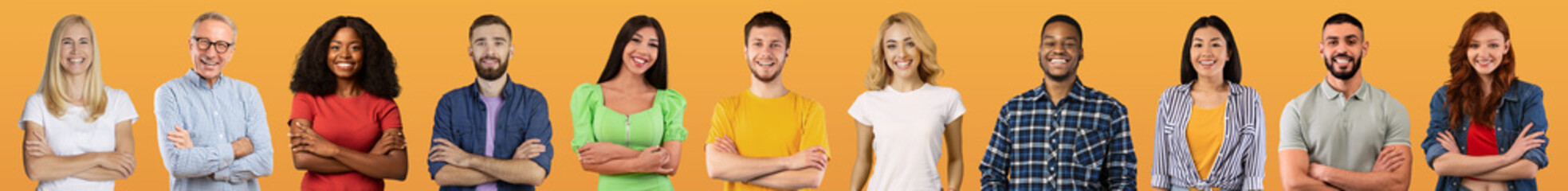 Beautiful international group of people posing on yellow studio background