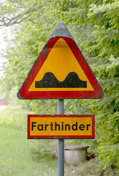 old damaged traffic sign with the information of speed bumps "Fahrthinder" in Sweden