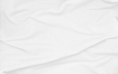 crumpled white sackcloth texture use as backgrounfd. natural bright white cloth texture close up of coarse fabric for backdrop. creases on fabric with blank space for design.