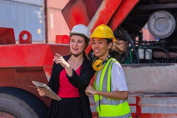 Team worker American women Work in an international shipping yard area Export and import delivery...