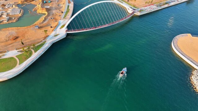 Aerial Tilt Up Shot Of Tourists Exploring Bridge Over Sea Amidst Landscape - Colombo, Sri Lanka