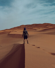 Fototapeta na wymiar person walking in desert
