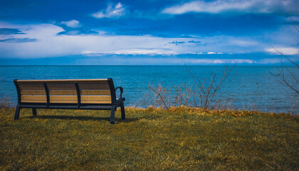An empty bench overlooking Lake Erie in Geneva-On-The-Lake, Ohio