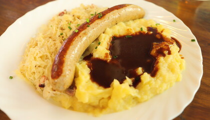 mashed potatoes with sausage and pickled cabbage