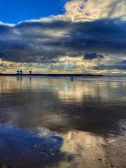 Fototapeta premium Rays of sunlight on a Welsh beach