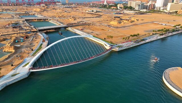 Aerial Panning Shot Of The Port Footbridge Over Sea In International Financial City - Colombo, Sri Lanka